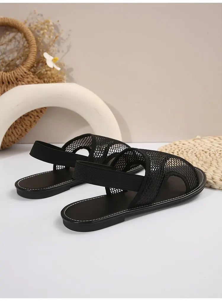 Women's stylish and breathable black mesh open - toe flat sandals. Versatile and comfortable.
