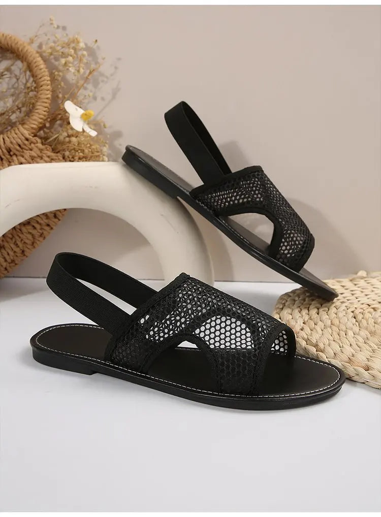 Women's stylish and breathable black mesh open - toe flat sandals. Versatile and comfortable.